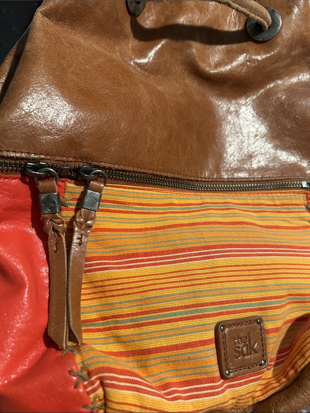 The Sak Brown Leather Drawstring Shoulder Bag with Orange Accents - Picture 3 of 9
